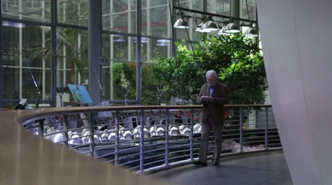 Man walks on the sphere bridge in a building Stock Footage 36156875