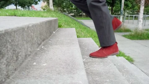 Man walks up stairs Stock Footage 288992439