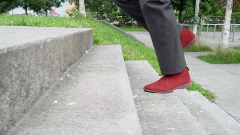 Man walks up stairs Stock Footage 289391259