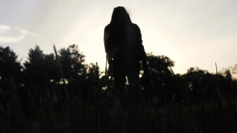 A man walks at sunset Stock Footage 130987842