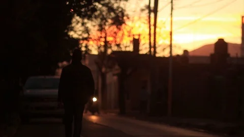  Man walks at sunset in a small town in Argentina, Latin America 스톡 동영상 123799547