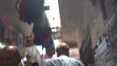 A man walks through the crowd in front of Istanbul Eminönü Stock Footage 180454318