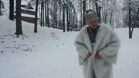 A man walks through deep snow in winter forest weather white landscape, cold Video stock 109462202