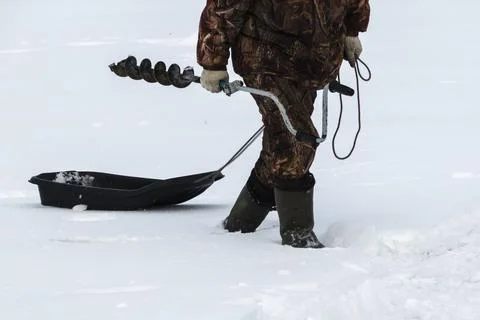 Man walks through deep snow Stock Photos