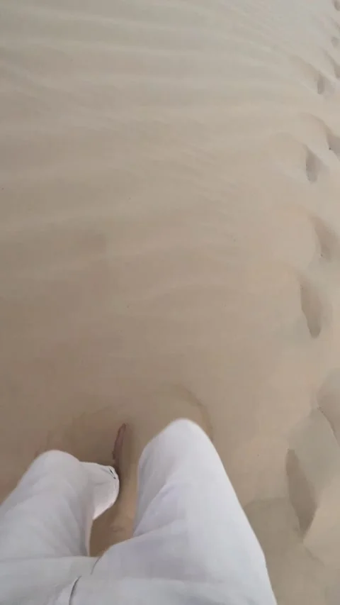 A man walks through the desert Video stock 253208562