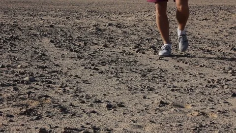 A man walks through the desert,monopod Stock Footage 76626426