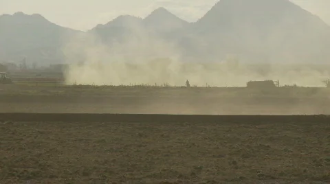 Man walks through dust cloud Stock Footage 371466