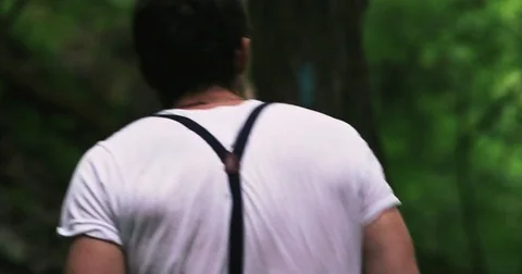 Man walks through forest 4K Stock Footage 71207596