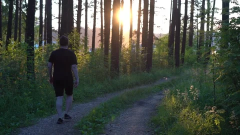 A man walks through the forest after quarantine Stock Footage 138861883
