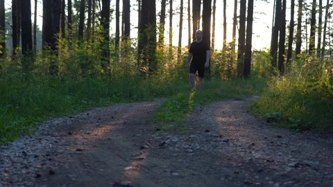A man walks through the forest after quarantine Stock Footage 140207289
