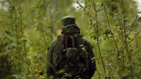 Man walks through the forest and then turns around Stock-Footage 93539985