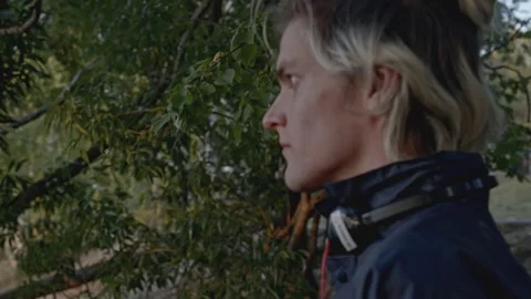 Man walks through forest and finds something. Stock. Young man comes out of Stock Footage 276915171