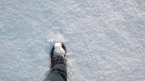 A man walks through the snow in boots Stock Footage 147246030