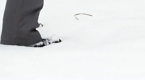 Man walks through the snow Stock Footage 10748773