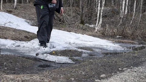 A man walks through the spring forest in the afternoon, going into the distance Stock Footage 111145022