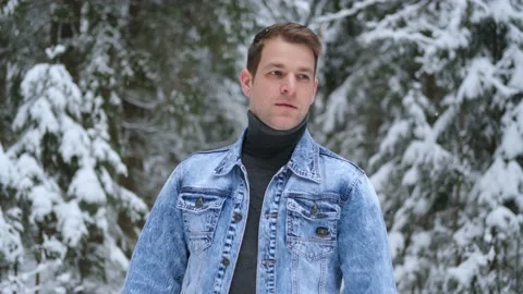 A man walks through the winter forest Stock Footage 147159985