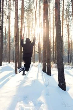 A man walks through the winter forest Stock Photos