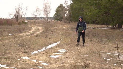 A man walks through the woods Stock Footage 74139899