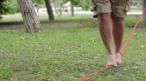 A man walks a tightrope Stock-Footage 53780509