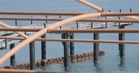 A man walks under the pier Video stock 232289300