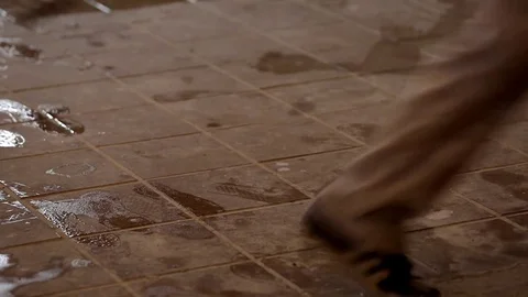The man walks the wet floor Stock Footage 75216996
