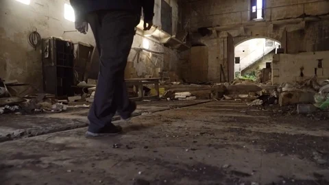 Man walkthrough abandoned warehouse Stock Footage 73675181