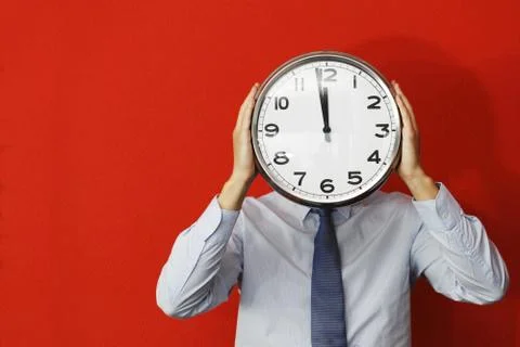 Man with wall clock Stock Photos