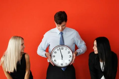 Man with wall clock Stock Photos