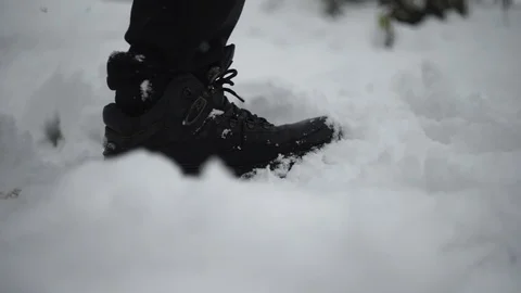 Man wanders snow, heavy snowfall, closeup Stock Footage 114630943