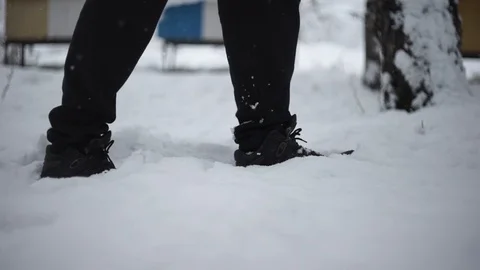 A man wanders snow, snow falls, winter Stock Footage 114630935