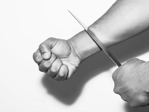 Man want to commit suicide by cutting his veins with knife on white backgroun Stock Photos