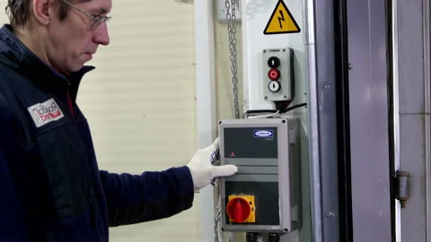 Man warehouse worker pinches and checks fixture button Stock Footage 238468106