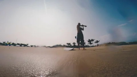 Man warm up on the beach before surfing Stock Footage 80534257