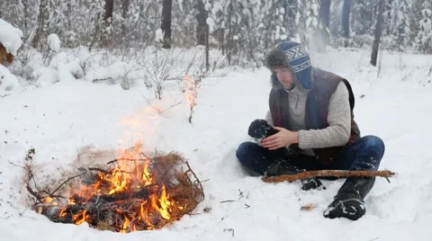 Man Warm Hands by Winter Campfire Stock Footage 59540667