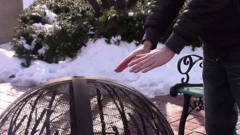 Man Warming Hands by Public Fire 2 Stock Footage 233469897