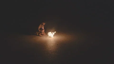 Man is warming himself by the fire. 4k cinematic video Stock Footage 91589025