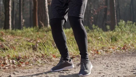 Man warming up before jogging Stock Footage 102823974