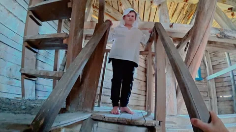 The man was afraid of the strange boy on the tower. From the first person. Stock Footage 314674174