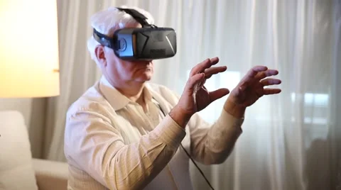 Man was uses head mounted display Virtual reality mask Stock Footage 60576167