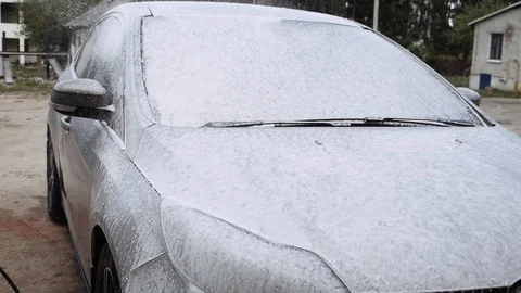 A man washes the car himself. Video stock 108849934