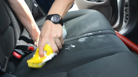 The man washes the car inside (interior) - brush Stock-Footage 38704843