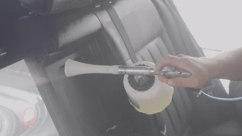 The man washes the car salon Stock Footage 93625699