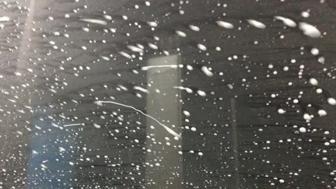 Man washes car windows Video stock 152239971