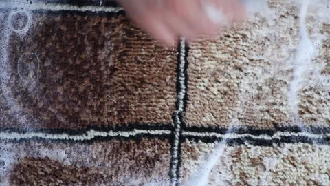 A man washes a carpet. Cleaning and housekeeping Stock Footage 265199356