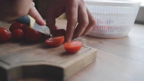 A man washes, cleans and cuts vegetables Stock Footage 131495131
