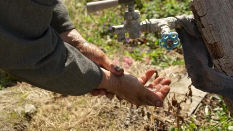 A man washes dirty hands Stock Footage 181984528
