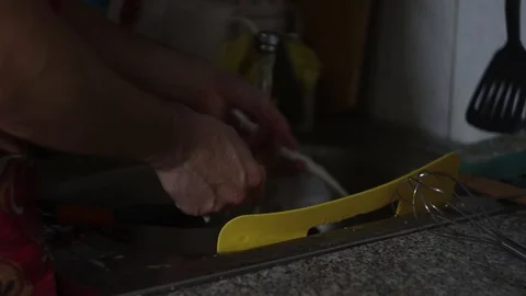 Man washes dishes  Stock Footage 117621710