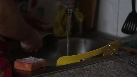 Man washes dishes  Stock Footage 117621876