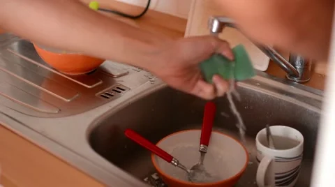 Man washes dishes in the kitchen 動画素材 41298581