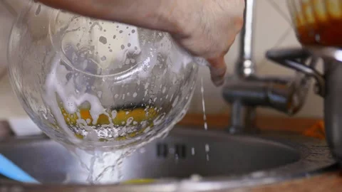 Man washes dishes at the sink closeup. Home routine,everyday life concept. Video stock 304752202